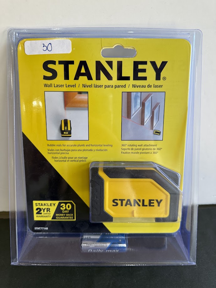 Stanley wall laser level kit in yellow packaging with a yellow and black laser level and battery; shows product name STANLEY on front.